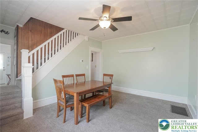 126 W High St, Coaldale Boro, PA 18218 - dining space featuring carpet floors, stairway, crown molding, and a ceiling fan
