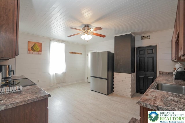 126 W High St, Coaldale Boro, PA 18218 - kitchen with freestanding refrigerator, a ceiling fan, dark countertops, wooden walls, and wood ceiling