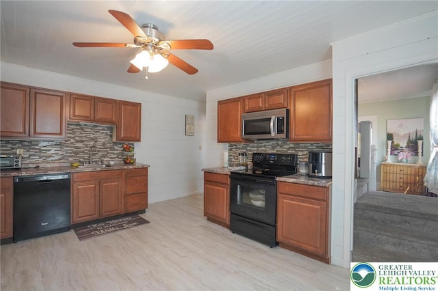 126 W High St, Coaldale Boro, PA 18218 - kitchen featuring black appliances, tasteful backsplash, ceiling fan, brown cabinets, and light wood-style flooring