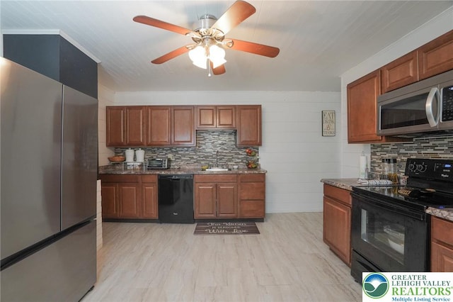 126 W High St, Coaldale Boro, PA 18218 - kitchen with black appliances, a ceiling fan, tasteful backsplash, dark stone countertops, and brown cabinetry