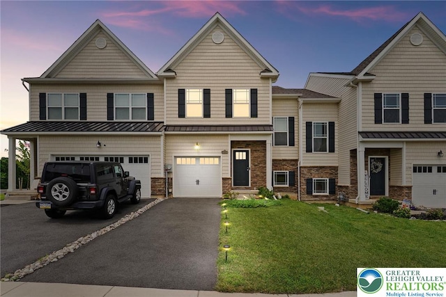 4435 Benjamin Ct, Upper Milford Twp, PA 18049 - view of front of property featuring driveway, a garage, a standing seam roof, and stone siding