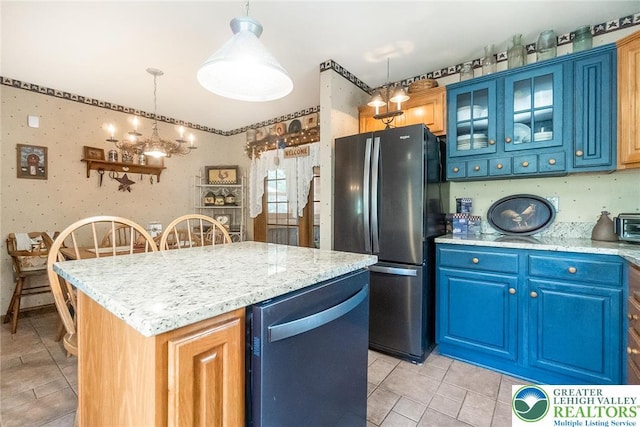 2300 Woodridge Ter, Easton, PA 18045 - kitchen featuring freestanding refrigerator, dishwasher, a center island, wallpapered walls, and blue cabinets