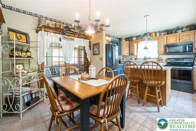 2300 Woodridge Ter, Easton, PA 18045 - dining area featuring a chandelier and light tile patterned floors