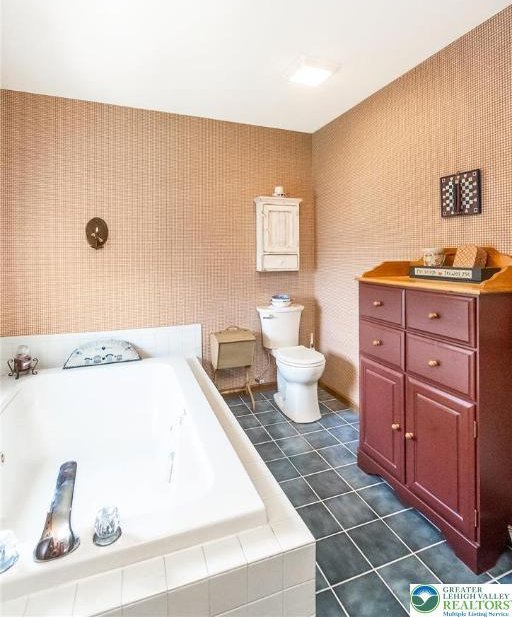 2300 Woodridge Ter, Easton, PA 18045 - full bathroom featuring a garden tub and tile patterned flooring