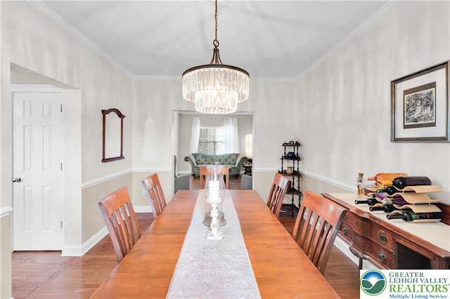 4325 Crosswinds Dr, Easton, PA 18045 - dining space featuring wood finished floors, a chandelier, and crown molding