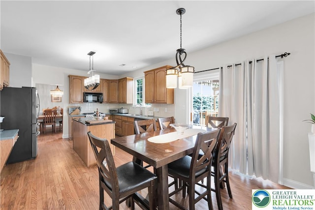 4325 Crosswinds Dr, Easton, PA 18045 - dining space featuring light wood-type flooring and a chandelier