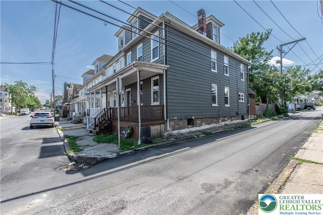 133 S 14th St, Easton, PA 18042 - view of property exterior featuring a porch and a chimney