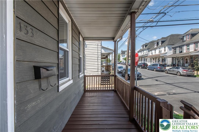 133 S 14th St, Easton, PA 18042 - wooden porch featuring a residential view