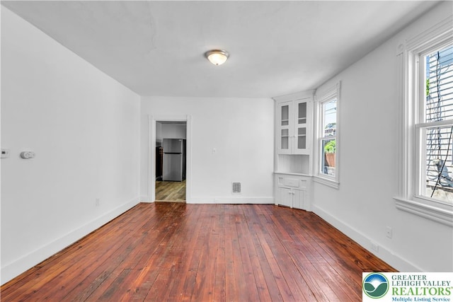 133 S 14th St, Easton, PA 18042 - empty room featuring dark wood-type flooring and baseboards