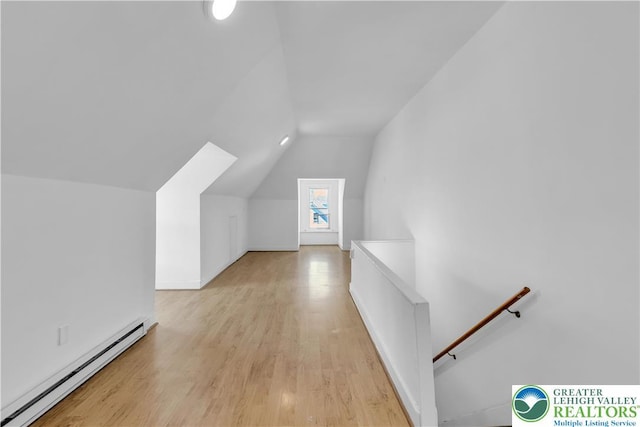133 S 14th St, Easton, PA 18042 - bonus room featuring a baseboard radiator, vaulted ceiling, and light wood-style floors