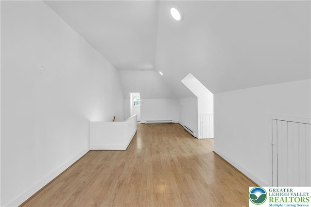 133 S 14th St, Easton, PA 18042 - additional living space featuring a baseboard heating unit, lofted ceiling, wood finished floors, and baseboard heating