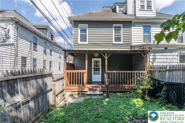 133 S 14th St, Easton, PA 18042 - back of property with a fenced backyard and a shingled roof