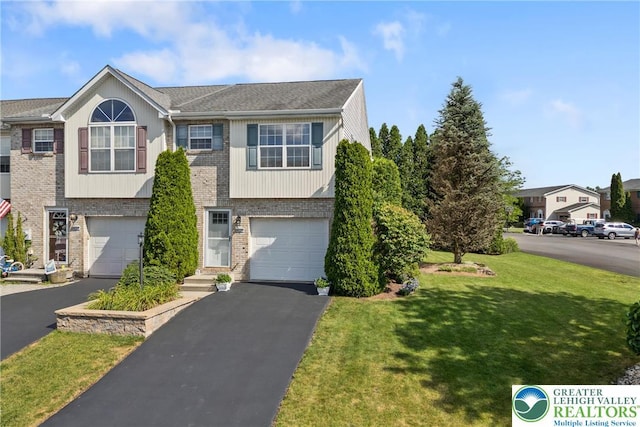 4220 Cheyenne Ct, North Whitehall Twp, PA 18078 - view of front of house featuring brick siding, a front yard, driveway, and an attached garage