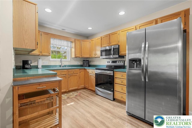 4220 Cheyenne Ct, North Whitehall Twp, PA 18078 - kitchen featuring appliances with stainless steel finishes, light wood-style floors, dark countertops, and recessed lighting