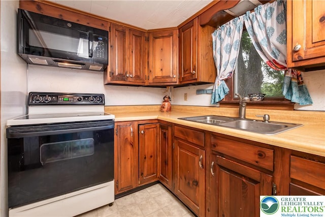 1155 Lake Minsi Dr, Upper Mt Bethel Twp, PA 18013 - kitchen with white electric range oven, black microwave, light countertops, and brown cabinets