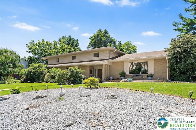 1048 N 27th St, Allentown City, PA 18104 - view of front of property with a front lawn and brick siding