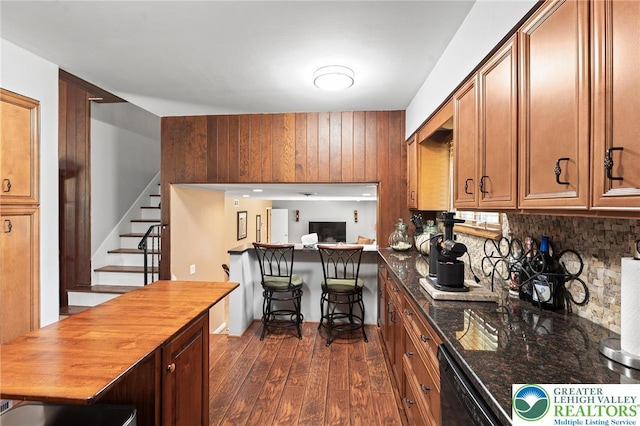 1048 N 27th St, Allentown City, PA 18104 - kitchen featuring dark wood-type flooring, brown cabinetry, tasteful backsplash, dishwasher, and butcher block counters