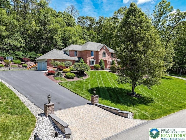 1376 Buck Ridge Dr, Hamilton Twp, PA 18360 - view of front facade with a front lawn, asphalt driveway, and a chimney