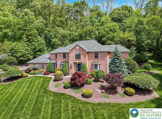 1376 Buck Ridge Dr, Hamilton Twp, PA 18360 - colonial house featuring a front yard and brick siding