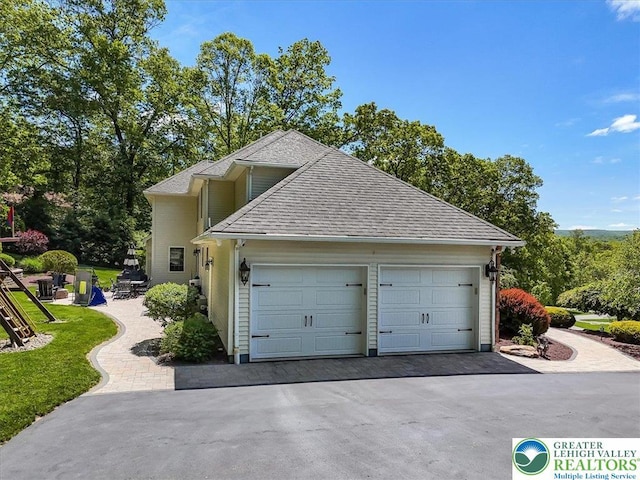 1376 Buck Ridge Dr, Hamilton Twp, PA 18360 - view of home's exterior with an attached garage, driveway, and a shingled roof
