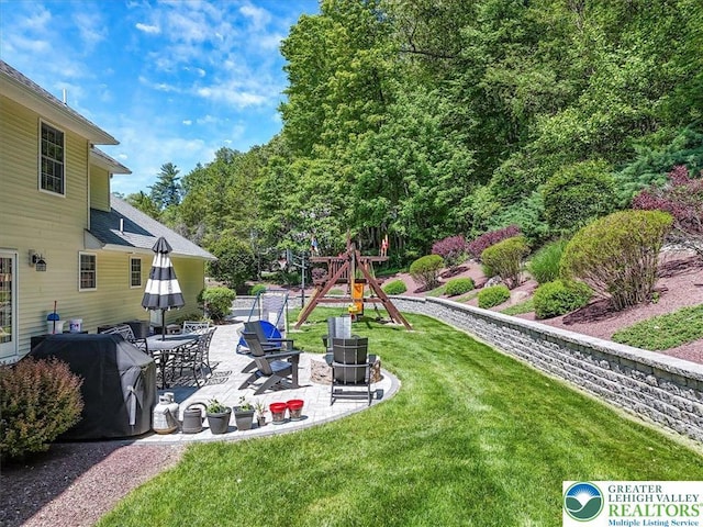 1376 Buck Ridge Dr, Hamilton Twp, PA 18360 - view of grassy yard featuring a playground and a patio area