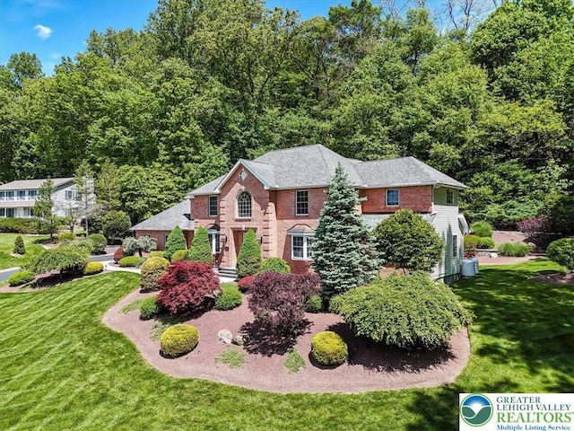 1376 Buck Ridge Dr, Hamilton Twp, PA 18360 - colonial inspired home featuring a front lawn and brick siding