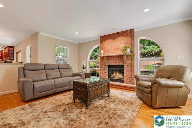 1376 Buck Ridge Dr, Hamilton Twp, PA 18360 - living area featuring wood finished floors, recessed lighting, ornamental molding, and a fireplace