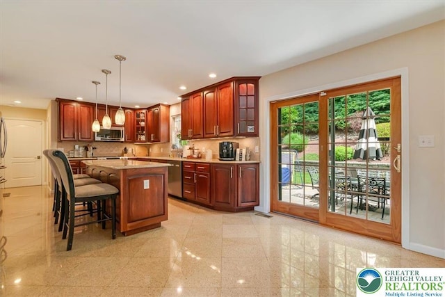 1376 Buck Ridge Dr, Hamilton Twp, PA 18360 - kitchen with stainless steel appliances, granite tiled floors, glass insert cabinets, recessed lighting, and healthy amount of natural light