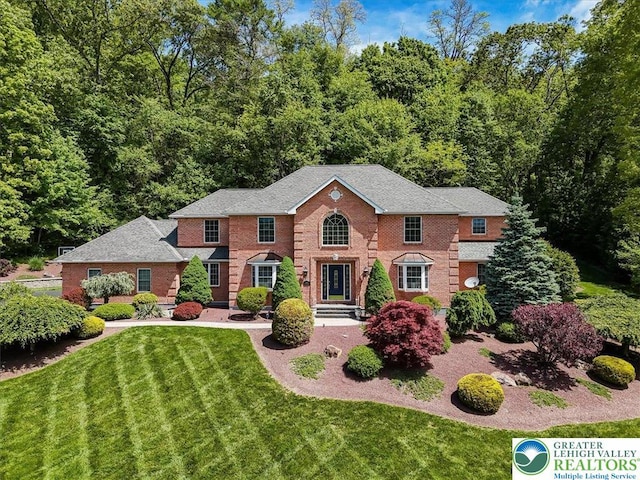 1376 Buck Ridge Dr, Hamilton Twp, PA 18360 - view of front of home featuring a front lawn and brick siding