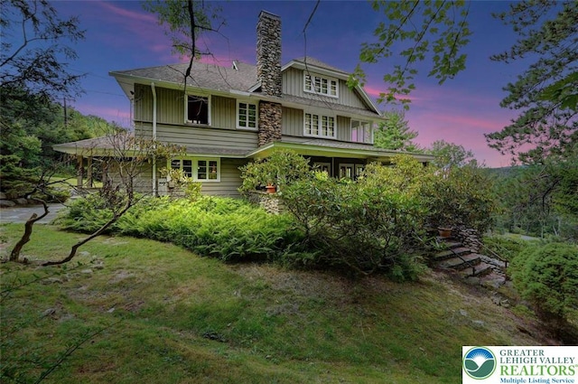 664 Griscom Rd, Barrett Twp, PA 18323 - back of property featuring a chimney and board and batten siding