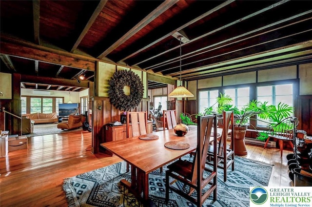 664 Griscom Rd, Barrett Twp, PA 18323 - dining room with hardwood / wood-style floors, wood walls, and beam ceiling