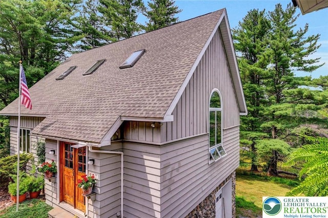 664 Griscom Rd, Barrett Twp, PA 18323 - view of front of house with a shingled roof and board and batten siding