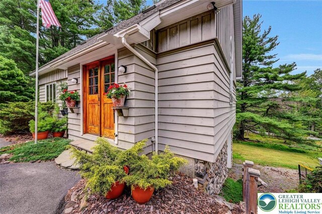 664 Griscom Rd, Barrett Twp, PA 18323 - view of home's exterior with board and batten siding