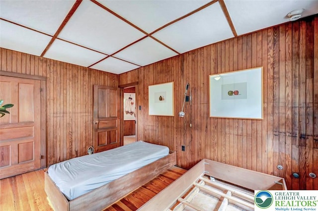 664 Griscom Rd, Barrett Twp, PA 18323 - bedroom with wooden walls and wood finished floors