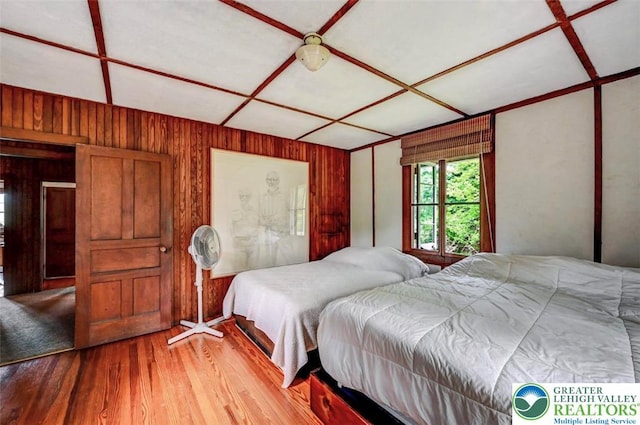 664 Griscom Rd, Barrett Twp, PA 18323 - bedroom featuring wood finished floors and wood walls