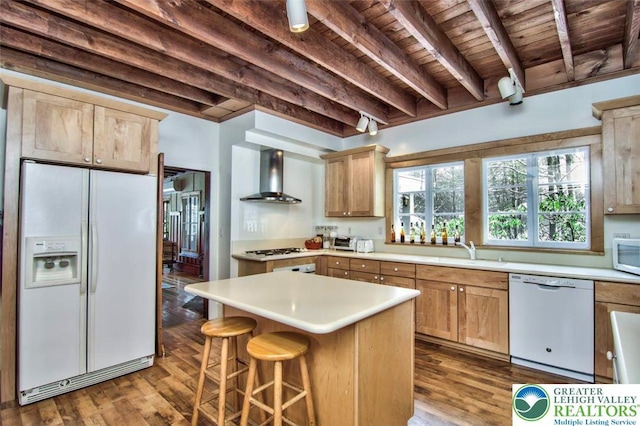 664 Griscom Rd, Barrett Twp, PA 18323 - kitchen with white appliances, wall chimney exhaust hood, a wooden ceiling with exposed beams, wood finished floors, and light countertops