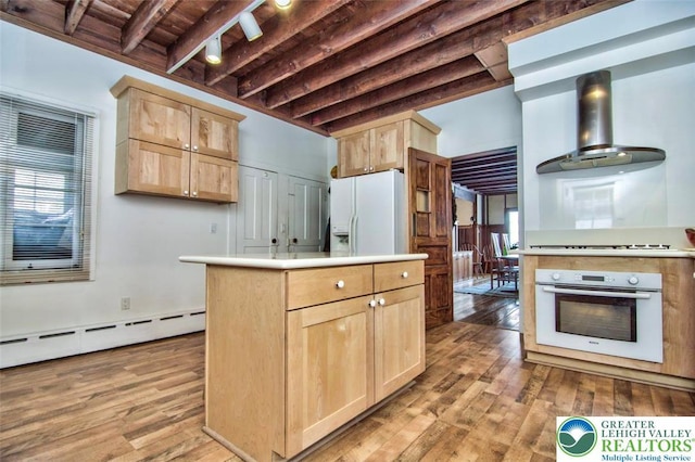 664 Griscom Rd, Barrett Twp, PA 18323 - kitchen with white appliances, light brown cabinetry, wall chimney exhaust hood, wood finished floors, and a wood ceiling with exposed beams