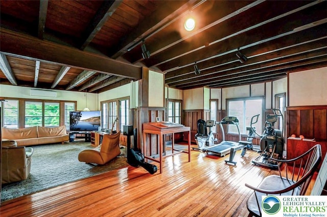 664 Griscom Rd, Barrett Twp, PA 18323 - miscellaneous room with hardwood / wood-style floors, a wainscoted wall, a wall unit AC, track lighting, and a wooden ceiling with exposed beams