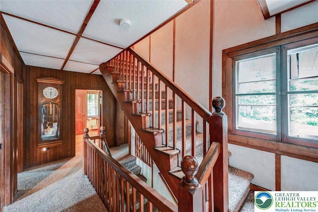 664 Griscom Rd, Barrett Twp, PA 18323 - staircase featuring carpet flooring and wood walls