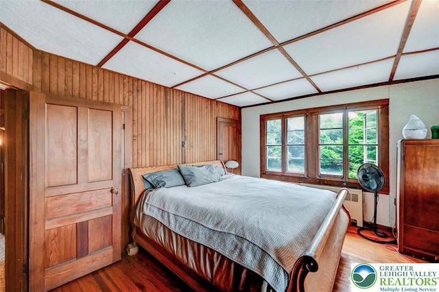 664 Griscom Rd, Barrett Twp, PA 18323 - bedroom featuring wooden walls and wood finished floors