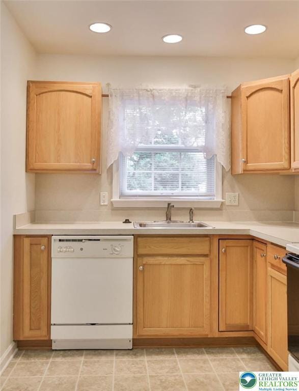 2638 Harvest Dr S, Forks Twp, PA 18040 - kitchen featuring white dishwasher, light countertops, light brown cabinets, recessed lighting, and range