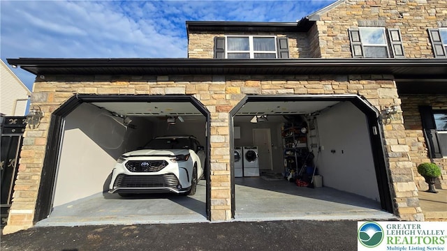 1136 Ashbourne Dr, Muhlenberg Twp, PA 19605 - garage featuring washer and clothes dryer