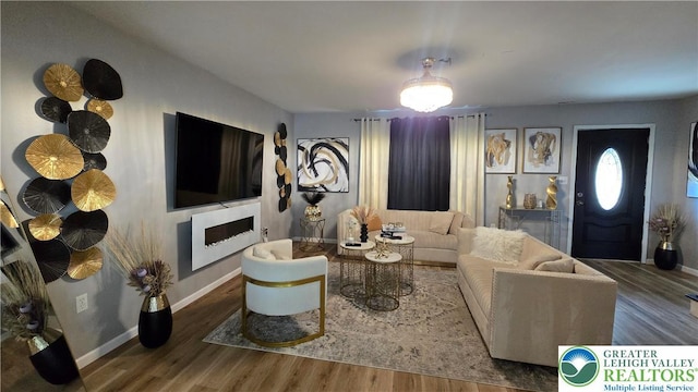 1136 Ashbourne Dr, Muhlenberg Twp, PA 19605 - living area with wood finished floors and baseboards