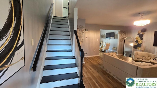 1136 Ashbourne Dr, Muhlenberg Twp, PA 19605 - stairs featuring wood finished floors and baseboards