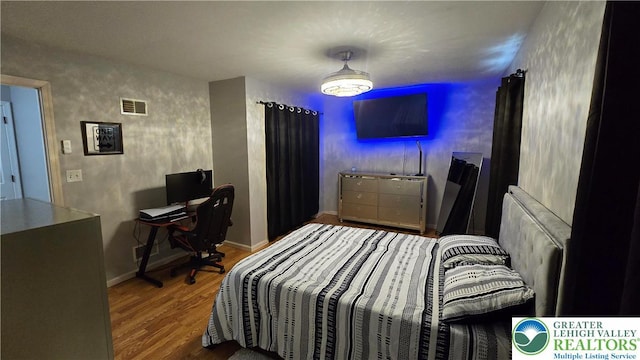 1136 Ashbourne Dr, Muhlenberg Twp, PA 19605 - bedroom featuring wood finished floors and baseboards