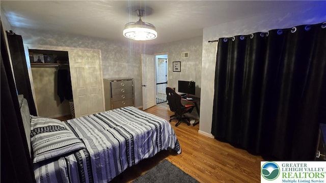 1136 Ashbourne Dr, Muhlenberg Twp, PA 19605 - bedroom with wood finished floors, a closet, and a desk
