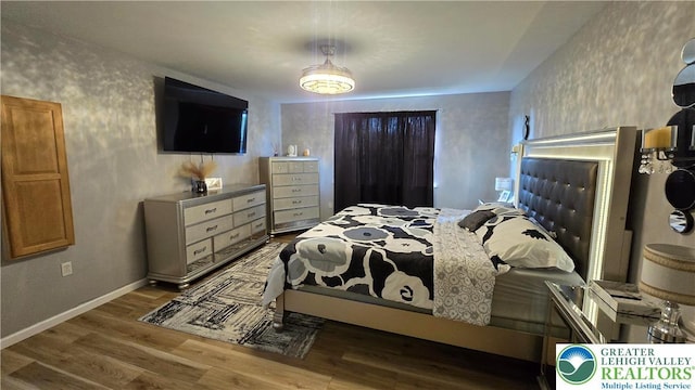 1136 Ashbourne Dr, Muhlenberg Twp, PA 19605 - bedroom with wood finished floors and baseboards