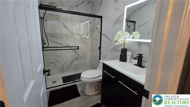 1136 Ashbourne Dr, Muhlenberg Twp, PA 19605 - full bath featuring a marble finish shower, vanity, and tile walls