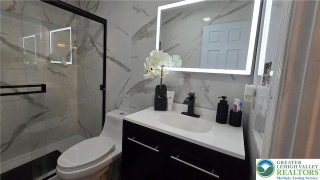 1136 Ashbourne Dr, Muhlenberg Twp, PA 19605 - bathroom featuring vanity and a marble finish shower