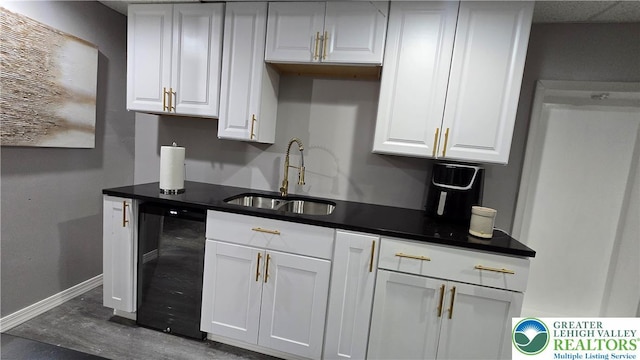 1136 Ashbourne Dr, Muhlenberg Twp, PA 19605 - kitchen featuring white cabinetry, dishwasher, and dark countertops